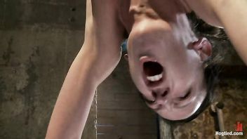 A hot slut arching back and cumming in an inverted suspension